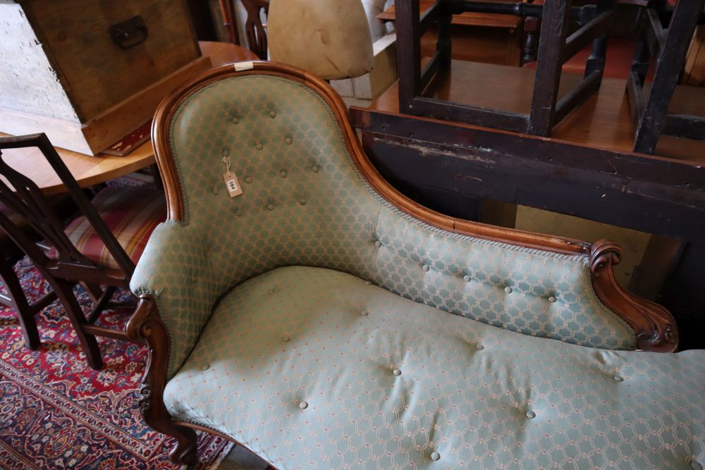 A Victorian carved walnut chaise longue, width 170cm, depth 75cm, height 90cm